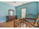 Spare bedroom with light blue walls, wood floors, and a black metal bed frame at 252 7Th Se St, Hickory, NC 28602