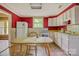 Classic kitchen showcasing white appliances, ample cabinet space, and natural light from the window at 252 7Th Se St, Hickory, NC 28602
