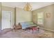 Cozy living room featuring classic furniture, a chandelier, and natural light from a window at 252 7Th Se St, Hickory, NC 28602