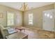 Vintage-style living room showcasing a chandelier, classic furniture, and two bright windows at 252 7Th Se St, Hickory, NC 28602