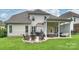 Spacious backyard featuring a patio, outdoor kitchen, and comfortable seating with a pergola at 2625 Rea Pond Ct, Charlotte, NC 28226