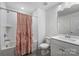 Bathroom with a shower and tub combination, a pink floral shower curtain, and white vanity at 2625 Rea Pond Ct, Charlotte, NC 28226
