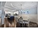 Bright dining room featuring dark hardwood floors and a modern chandelier at 2625 Rea Pond Ct, Charlotte, NC 28226