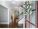 Elegant foyer showcasing hardwood floors, staircase with iron railings, and a view into adjacent living spaces at 2625 Rea Pond Ct, Charlotte, NC 28226