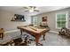 Game room with pool table, large TV, and neutral colors for fun and relaxation at 2625 Rea Pond Ct, Charlotte, NC 28226