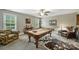 Entertaining game room featuring a pool table, unique cowhide rug, and natural light at 2625 Rea Pond Ct, Charlotte, NC 28226