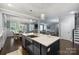 Modern kitchen with stainless steel sink, white countertops and dark hardwood floors at 2625 Rea Pond Ct, Charlotte, NC 28226