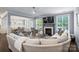 Bright, open living room with dark hardwood floors and an adjacent dining area at 2625 Rea Pond Ct, Charlotte, NC 28226
