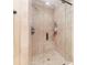 Shower with glass door and light-colored, tiled shower walls and base at 277 Tradition Dr, Mount Gilead, NC 27306