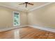 Bright bedroom features hardwood floors, crown molding, trim, and a large window offering ample natural light at 277 Tradition Dr, Mount Gilead, NC 27306