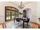 Bright dining room with large windows, wood floors, and a stylish chandelier at 277 Tradition Dr, Mount Gilead, NC 27306