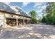 Spacious four-car garage with wood doors and ample parking on a paved driveway at 277 Tradition Dr, Mount Gilead, NC 27306