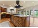Spacious kitchen featuring a large island, granite countertops, and an open layout to the living room at 277 Tradition Dr, Mount Gilead, NC 27306