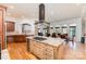 Open kitchen featuring a granite island, stainless steel appliances, and adjacent dining area at 277 Tradition Dr, Mount Gilead, NC 27306