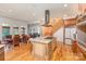 Open layout with kitchen island, granite countertop, stainless steel appliances, and dining space at 277 Tradition Dr, Mount Gilead, NC 27306