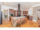 Spacious kitchen with granite island, stainless appliances, and hardwood floors at 277 Tradition Dr, Mount Gilead, NC 27306