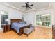 Spacious main bedroom with hardwood floors, trey ceilings, elegant furnishings, and ample natural light at 277 Tradition Dr, Mount Gilead, NC 27306