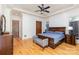 Bright main bedroom featuring a plush bed, a trey ceiling, and windows providing lovely views and natural light at 277 Tradition Dr, Mount Gilead, NC 27306