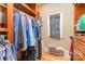 Organized walk-in closet featuring custom shelving and hanging rods for optimal storage and convenience at 277 Tradition Dr, Mount Gilead, NC 27306