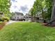 Spacious backyard with lush lawn, patio, fire pit area, and a multi-level deck for entertaining at 2804 Park Rd, Charlotte, NC 28209