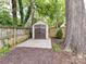 This backyard features a storage shed and fencing that borders the yard for privacy at 2804 Park Rd, Charlotte, NC 28209