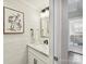 Stylish half-bath with shiplap walls, modern vanity, and elegant decorative touches at 2804 Park Rd, Charlotte, NC 28209