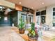 Inviting cafe entrance with outdoor seating and decorative planters create a charming ambiance at 2804 Park Rd, Charlotte, NC 28209