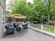 Spacious deck with comfortable outdoor seating and umbrella, perfect for relaxation at 2804 Park Rd, Charlotte, NC 28209