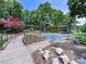 The exterior of this building features an entry way, curved sidewalk, landscaping and natural surroundings at 2804 Park Rd, Charlotte, NC 28209