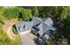Aerial view of the home features a gray roof, spacious driveway, and well-manicured landscaping at 2817 Lakefront Dr, Belmont, NC 28012