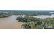 Beautiful aerial view showcases waterfront property with mature trees lining the shore of a large lake at 2817 Lakefront Dr, Belmont, NC 28012