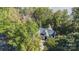 Aerial view of a home surrounded by lush trees, highlighting its private setting and architectural details at 2817 Lakefront Dr, Belmont, NC 28012