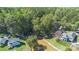 Aerial view shows the lakefront home's proximity to the water, boat dock, and wooded surroundings at 2817 Lakefront Dr, Belmont, NC 28012
