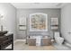 A relaxing bathroom featuring a sleek, modern soaking tub and elegant fixtures under a bright window at 2817 Lakefront Dr, Belmont, NC 28012