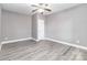Clean and bright bedroom with wood floors, ceiling fan, and neutral paint at 2817 Lakefront Dr, Belmont, NC 28012