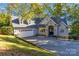 Two-story home with gray siding, dormer windows and an attached two-car garage set on a tree lined lot at 2817 Lakefront Dr, Belmont, NC 28012