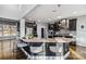 Modern kitchen with stone countertops, pendant lighting, stainless steel appliances and hardwood floors at 2817 Lakefront Dr, Belmont, NC 28012