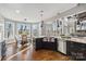 Kitchen with stainless appliances, island sink, granite counters and large bay windows at 2817 Lakefront Dr, Belmont, NC 28012