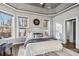 Relaxing main bedroom with a trey ceiling, large windows, and comfortable seating area at 2817 Lakefront Dr, Belmont, NC 28012