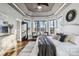 Beautiful main bedroom with trey ceiling, large windows, and elegant furnishings at 2817 Lakefront Dr, Belmont, NC 28012