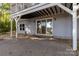 Exterior brick patio with a sliding glass door leading indoors, providing a seamless indoor-outdoor transition at 2817 Lakefront Dr, Belmont, NC 28012