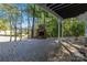 Outdoor brick patio boasts a stone fireplace and views of the lake, ideal for entertaining and relaxation at 2817 Lakefront Dr, Belmont, NC 28012