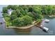 Estate on an island surrounded by water, lush trees, boat dock; lot lines shown at 2818 Cherry Ln, Denver, NC 28037