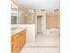 Well-lit bathroom with double vanity, soaking tub and step-in shower at 2818 Cherry Ln, Denver, NC 28037
