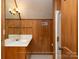 Wood paneled bathroom features a vanity and shower at 2818 Cherry Ln, Denver, NC 28037