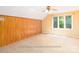 Bedroom features wood paneling and a large window at 2818 Cherry Ln, Denver, NC 28037