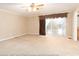 Large bedroom features a ceiling fan and sliding glass doors at 2818 Cherry Ln, Denver, NC 28037