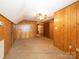 Wood paneled bedroom features a ceiling fan at 2818 Cherry Ln, Denver, NC 28037