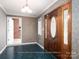 Entryway showcasing a decorative front door and vintage wallpaper at 2818 Cherry Ln, Denver, NC 28037