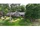 Charming single-Gathering home featuring a well-maintained lawn and mature landscaping at 2818 Cherry Ln, Denver, NC 28037